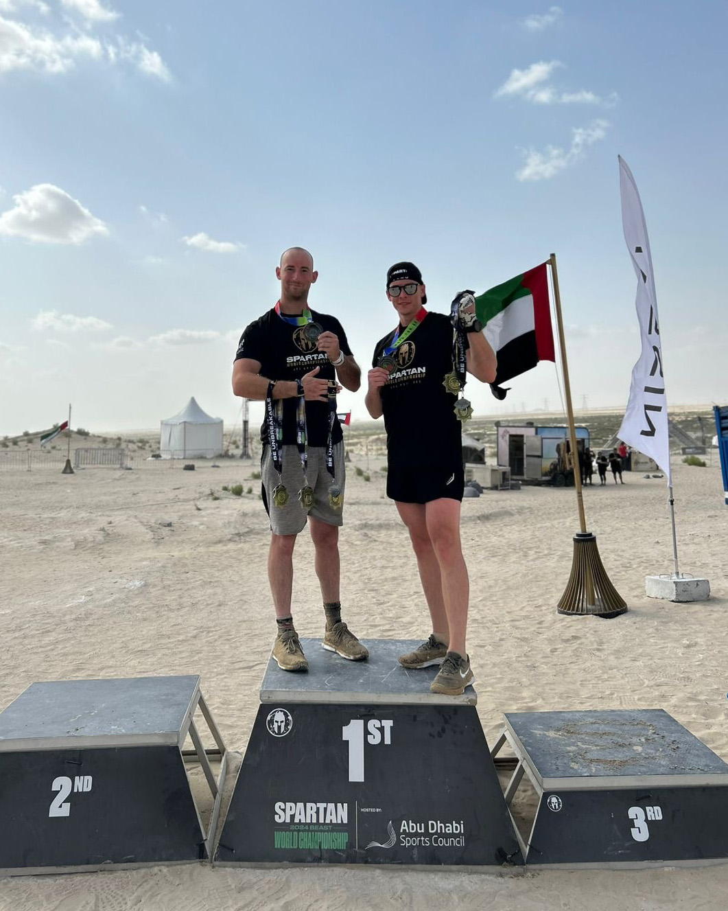 Trooper Debelak poses for a photo after finishing the Spartan Race in Abu Dhabi on a day off.