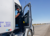 An AZDPS trooper speaks with a a truck driver during an inspection near I-10 in Eloy during Operation Southern Shield.